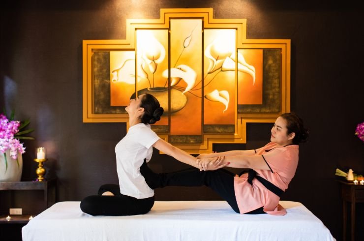 guest receiving a thai yoga massage at kiyora spa, chiang mai, thailand.