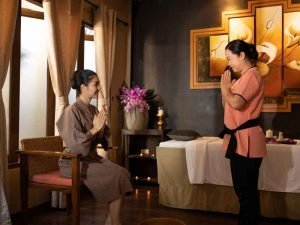 Massage therapist greeting guests just before preparation for an aromatherapy massage in a Chiang Mai spa. 