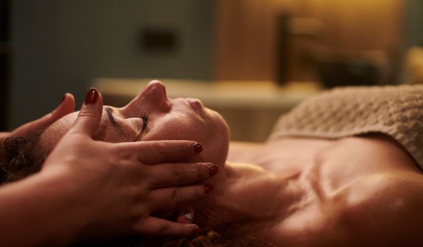 guest enjoying a massage and improving her mental health