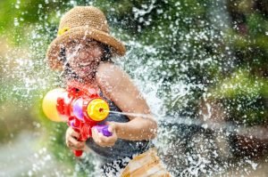 Songkran Festival 2023 in Chiang Mai: Girl playing with water gun