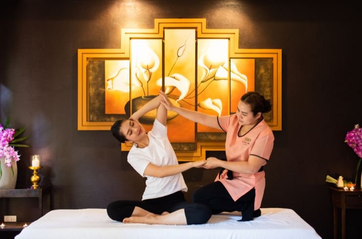 Kiyora Spa therapist performing Traditional Thai Massage pose with client.