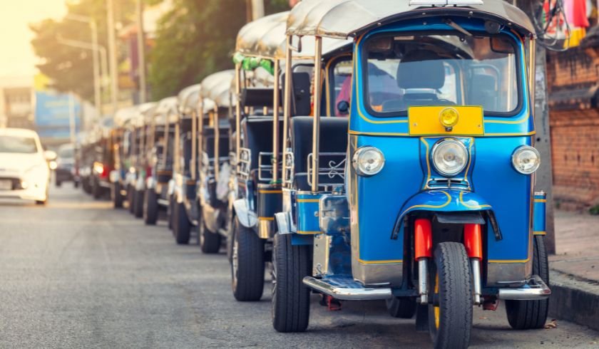 a line of tuk tuks waiting for customers during the quieter low season. 